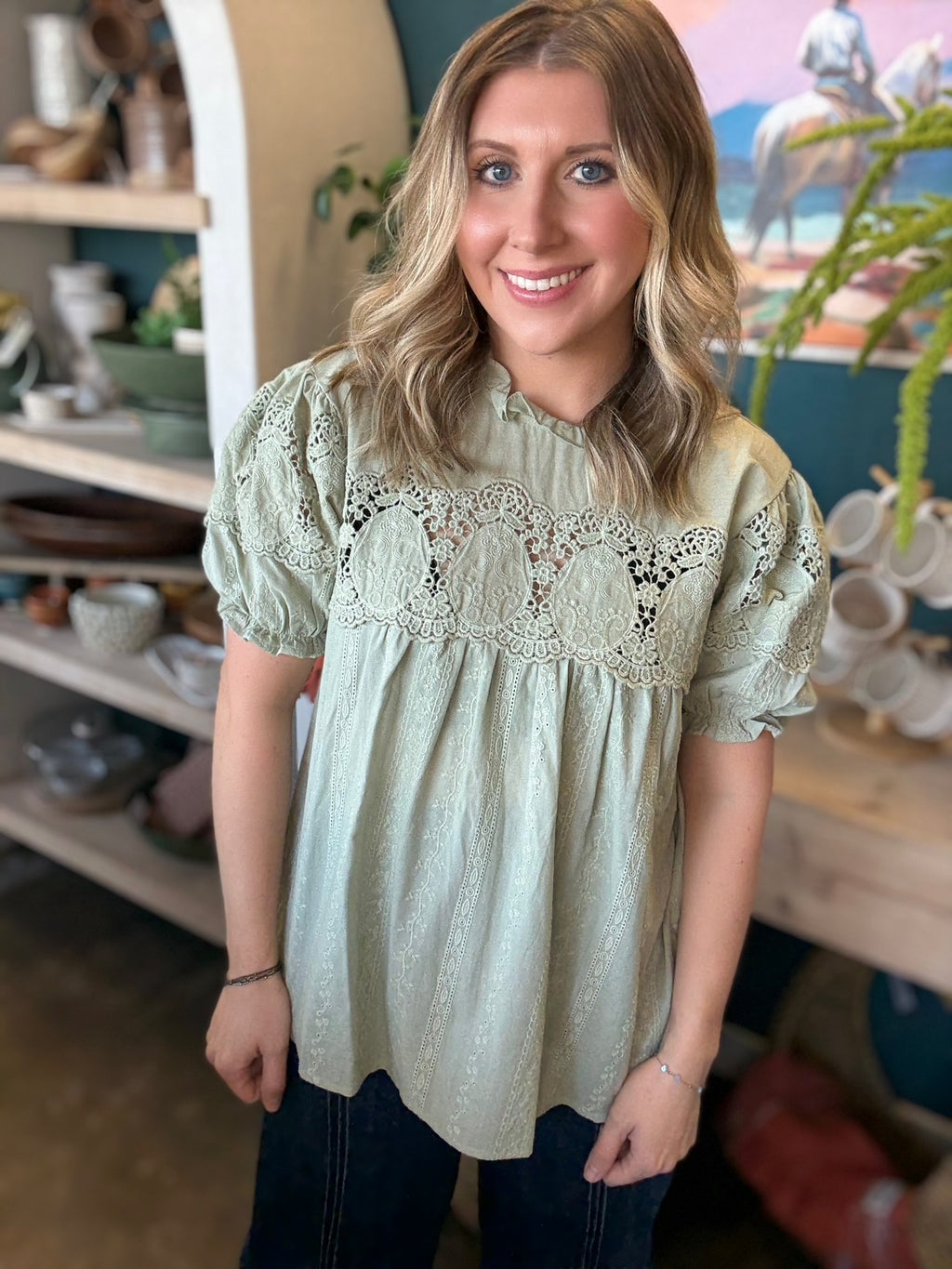 woman wearing sage green lace puff sleeve boutique blouse with embroidered fabric

Tags