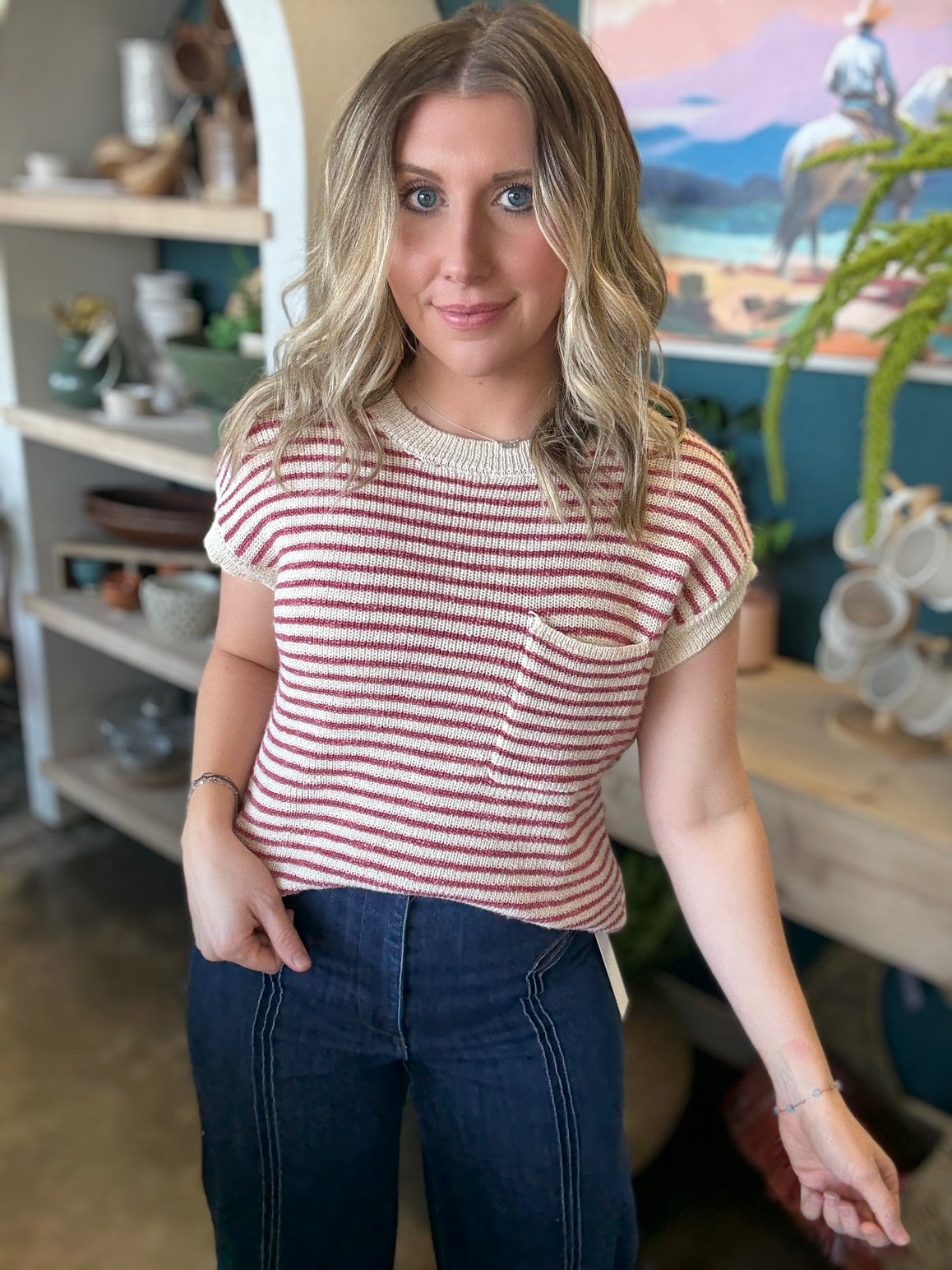 woman wearing red and cream striped boutique knit top with pocket