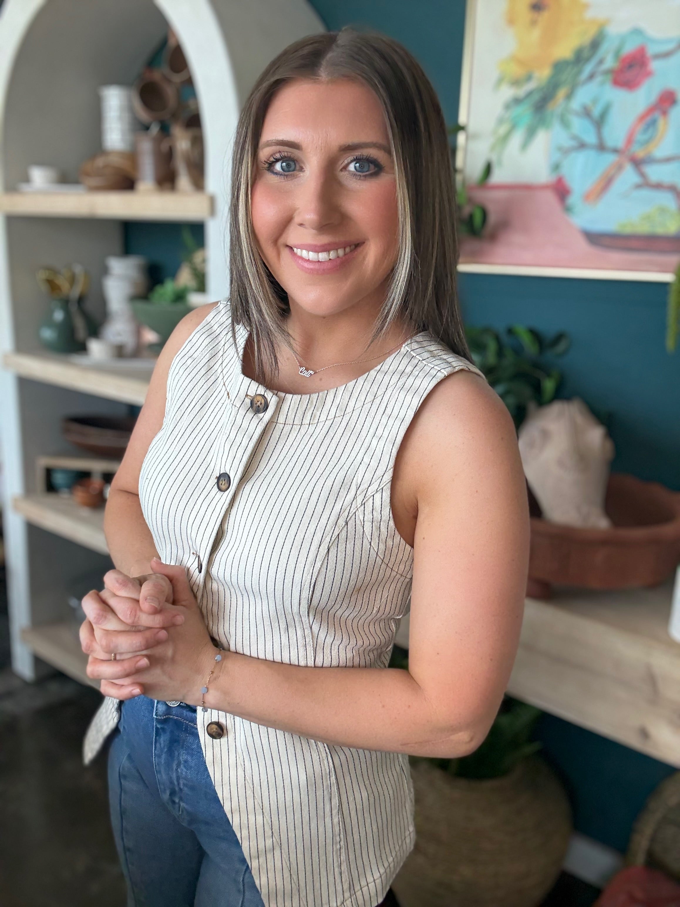 woman wearing natural striped sleeveless boutique button front tank top