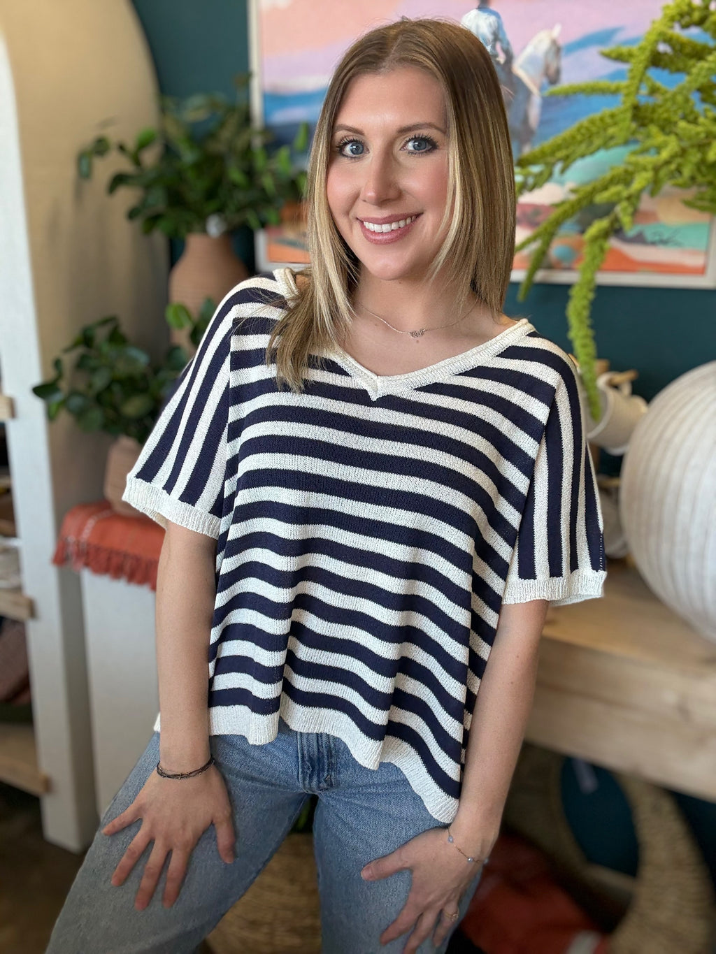 woman wearing navy striped boutique knit sweater top