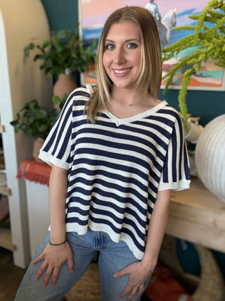 woman wearing navy striped boutique knit sweater top