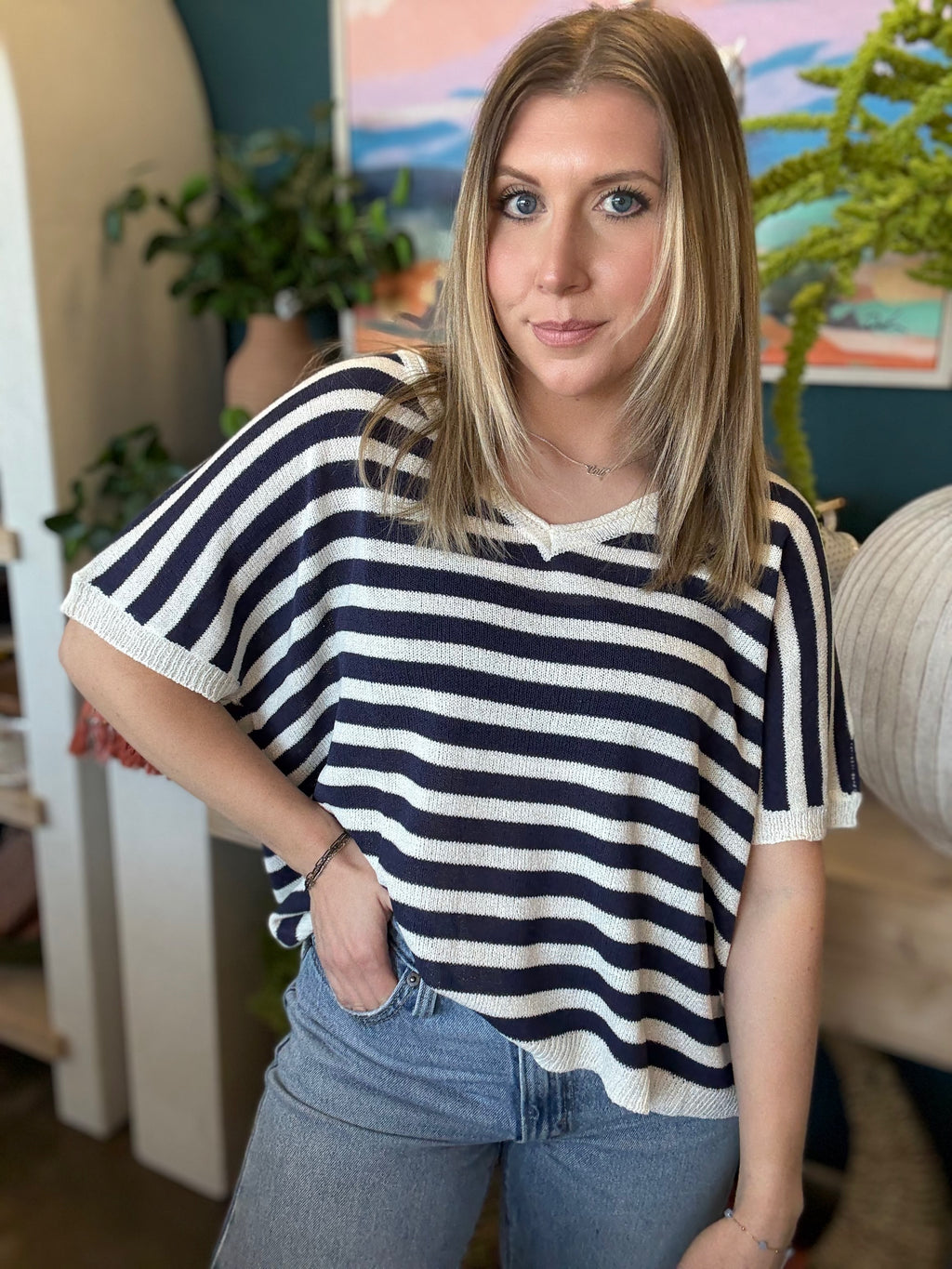 woman wearing navy striped boutique knit sweater top