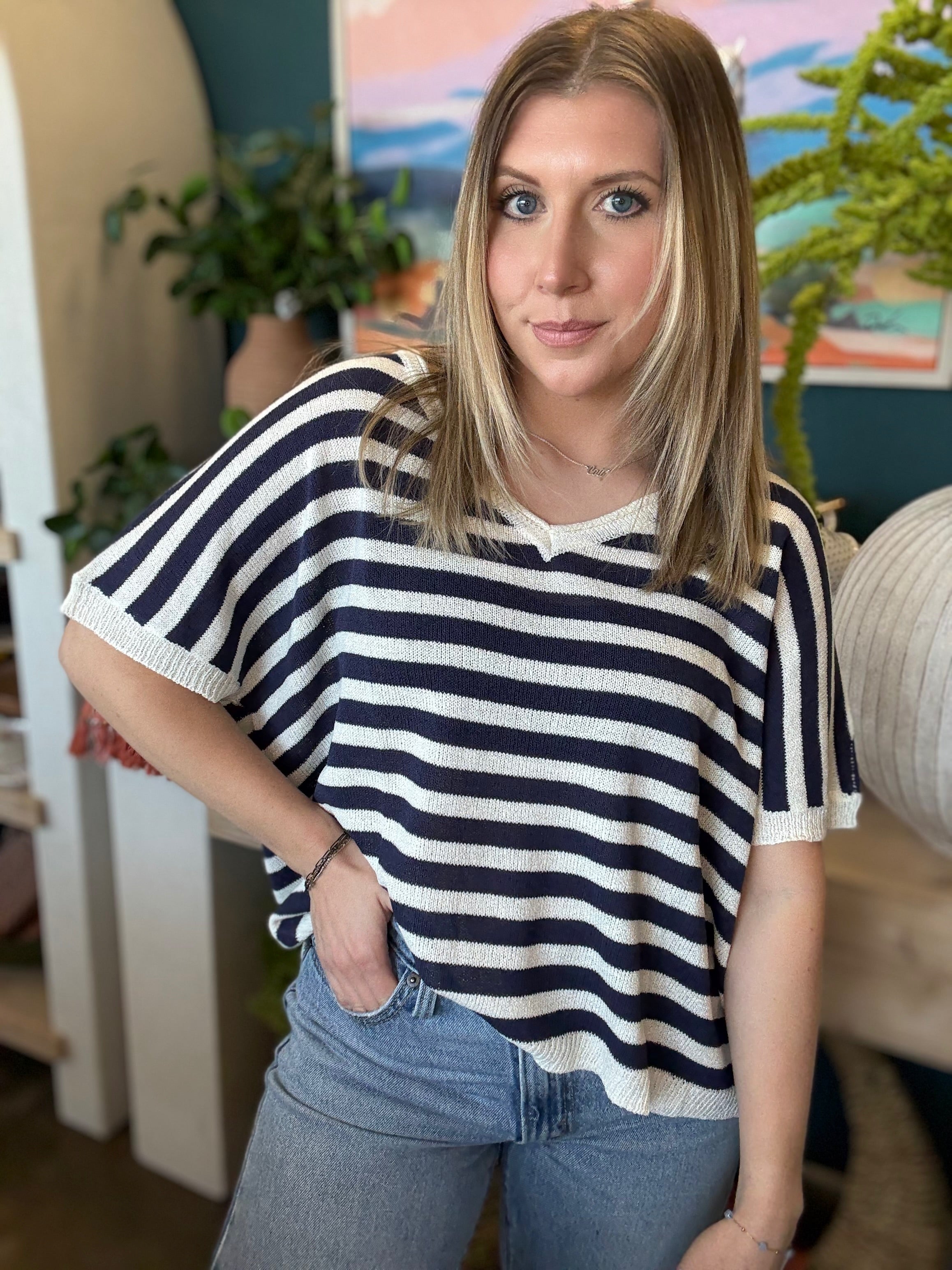 woman wearing navy striped boutique knit sweater top