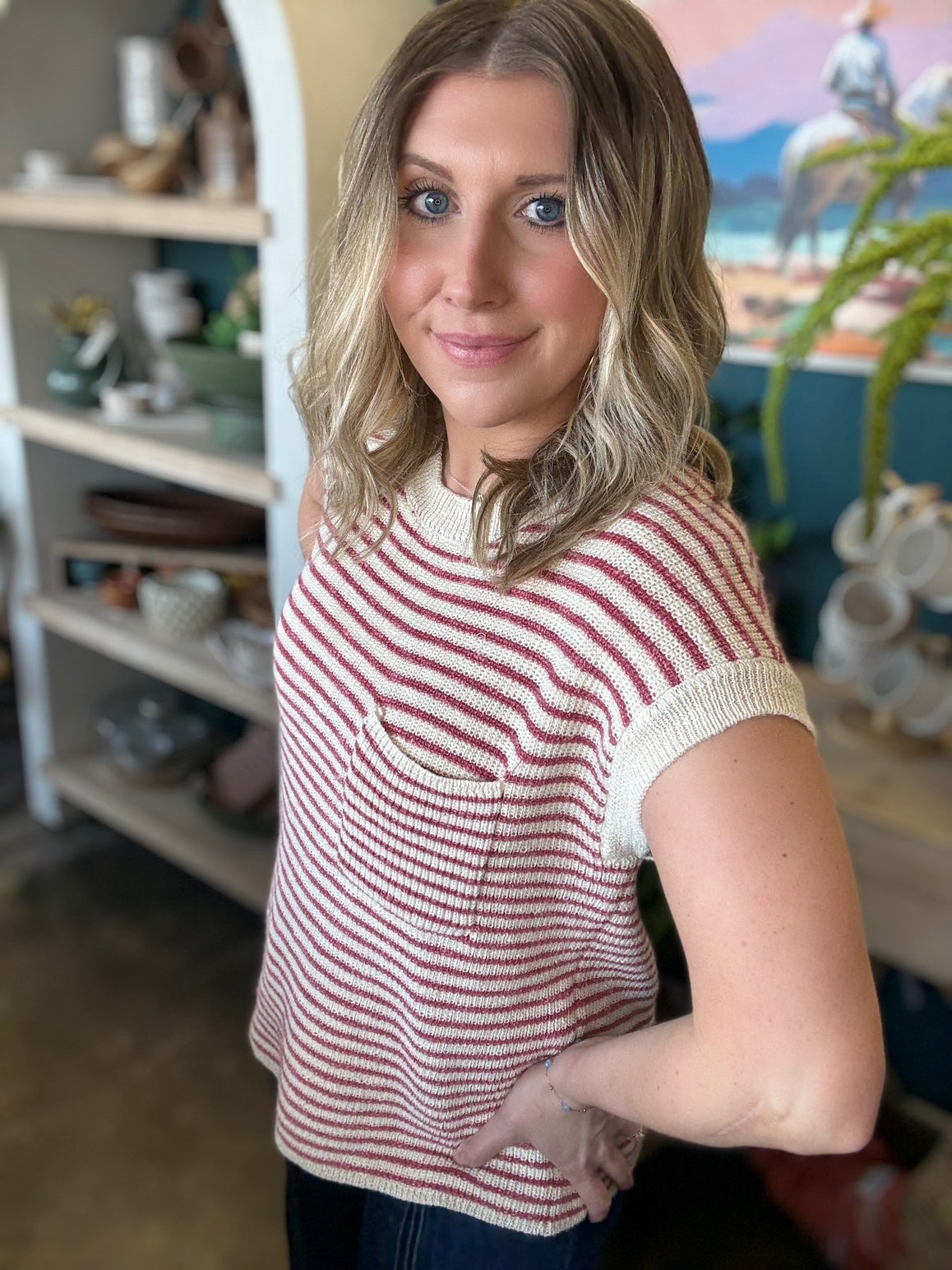 woman wearing red and cream striped boutique knit top with pocket