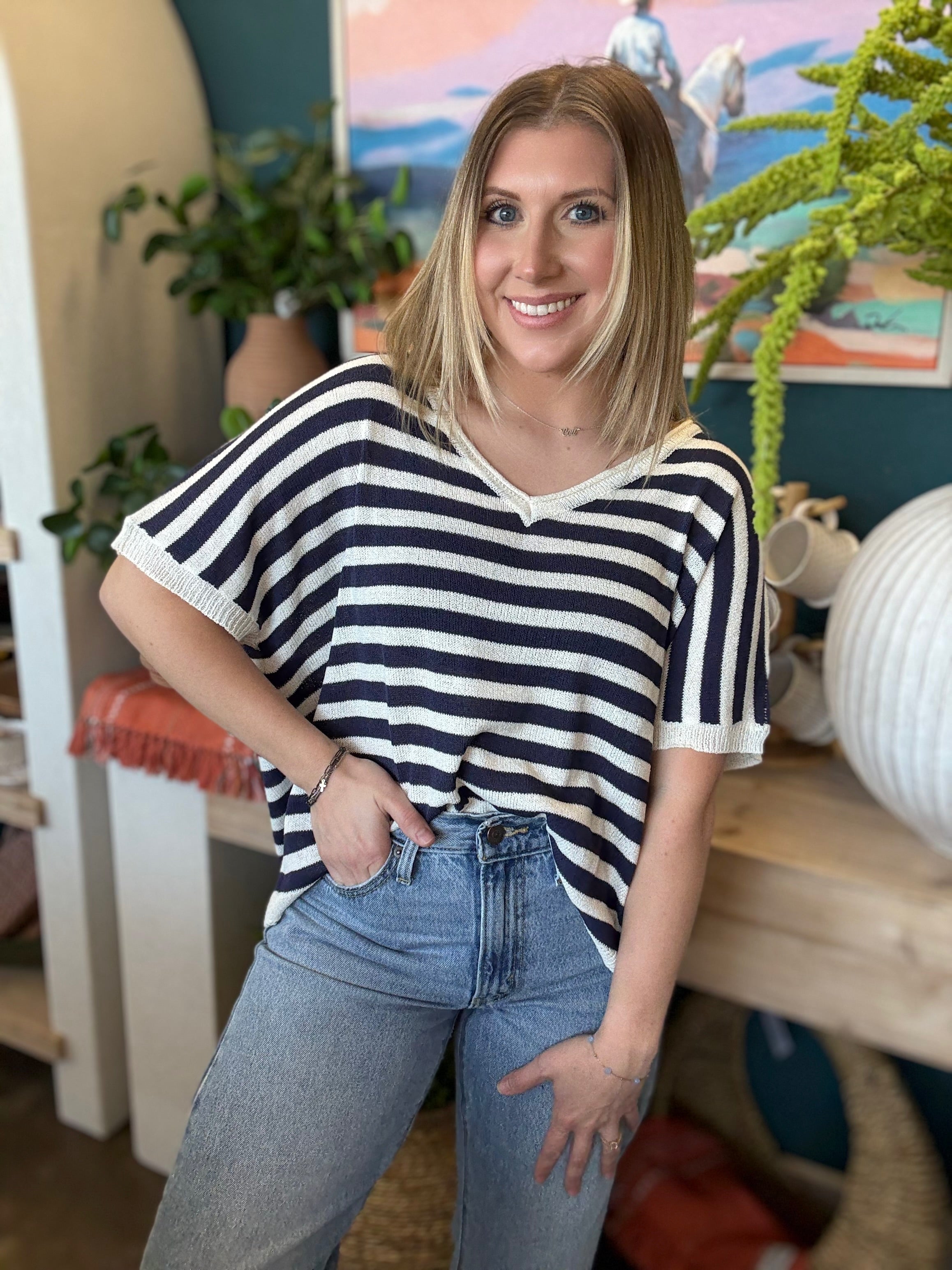 woman wearing navy striped boutique knit sweater top