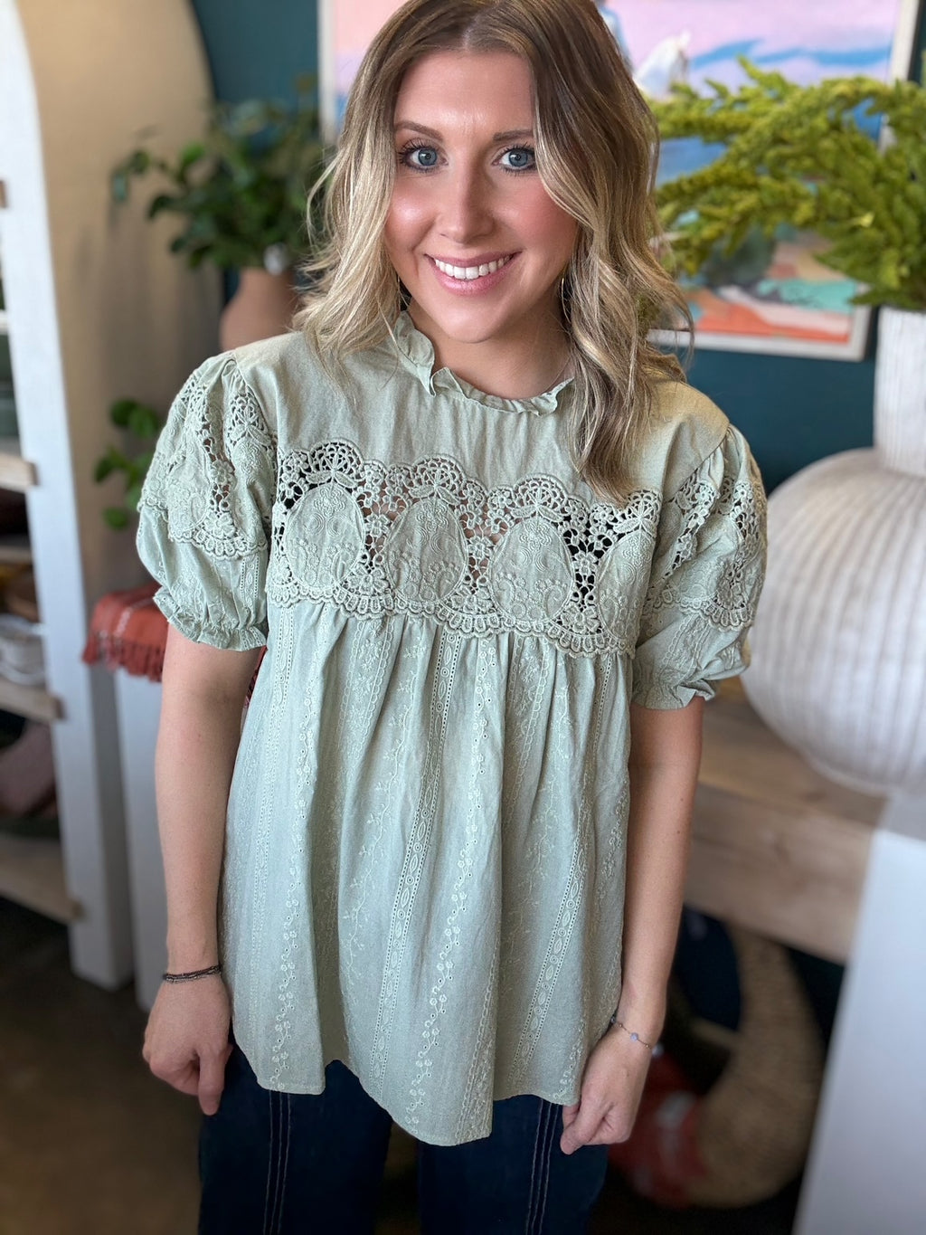 woman wearing sage green lace puff sleeve boutique blouse with embroidered fabric

Tags
