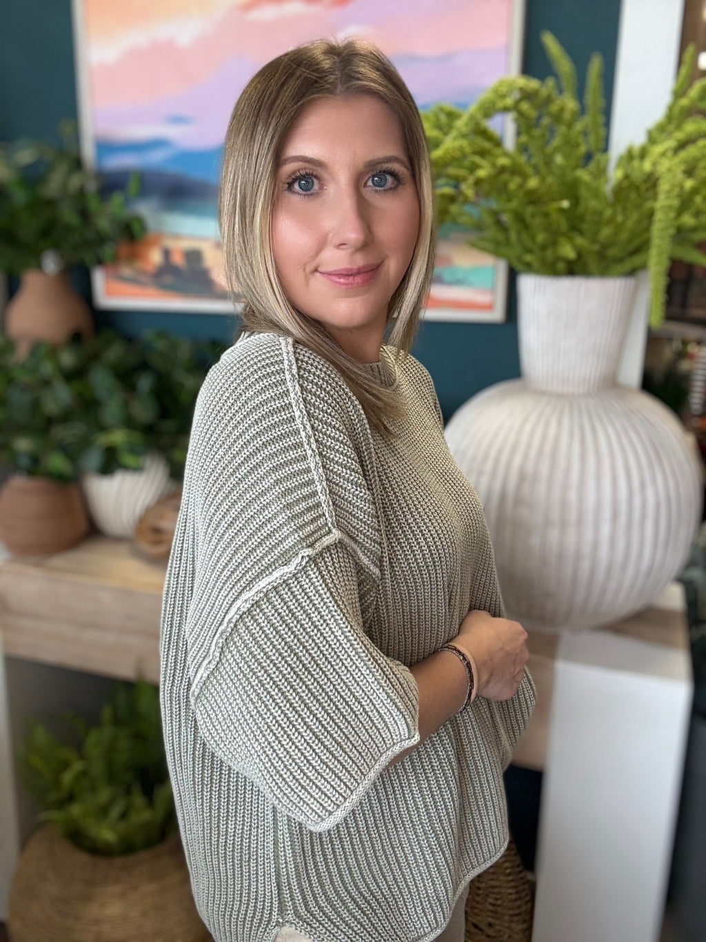 Sage ribbed knit short sleeve boutique top styled with neutral pants at Pill Box Boutique