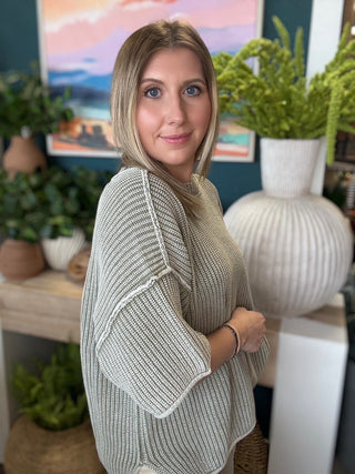Sage ribbed knit short sleeve boutique top styled with neutral pants at Pill Box Boutique