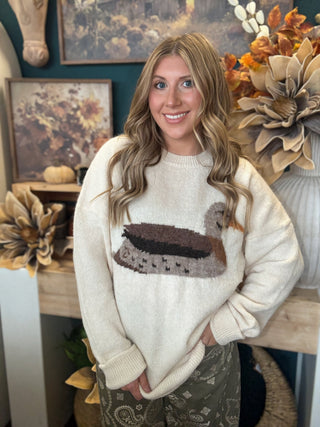 Ivory women’s sweater with oversized mallard duck graphic