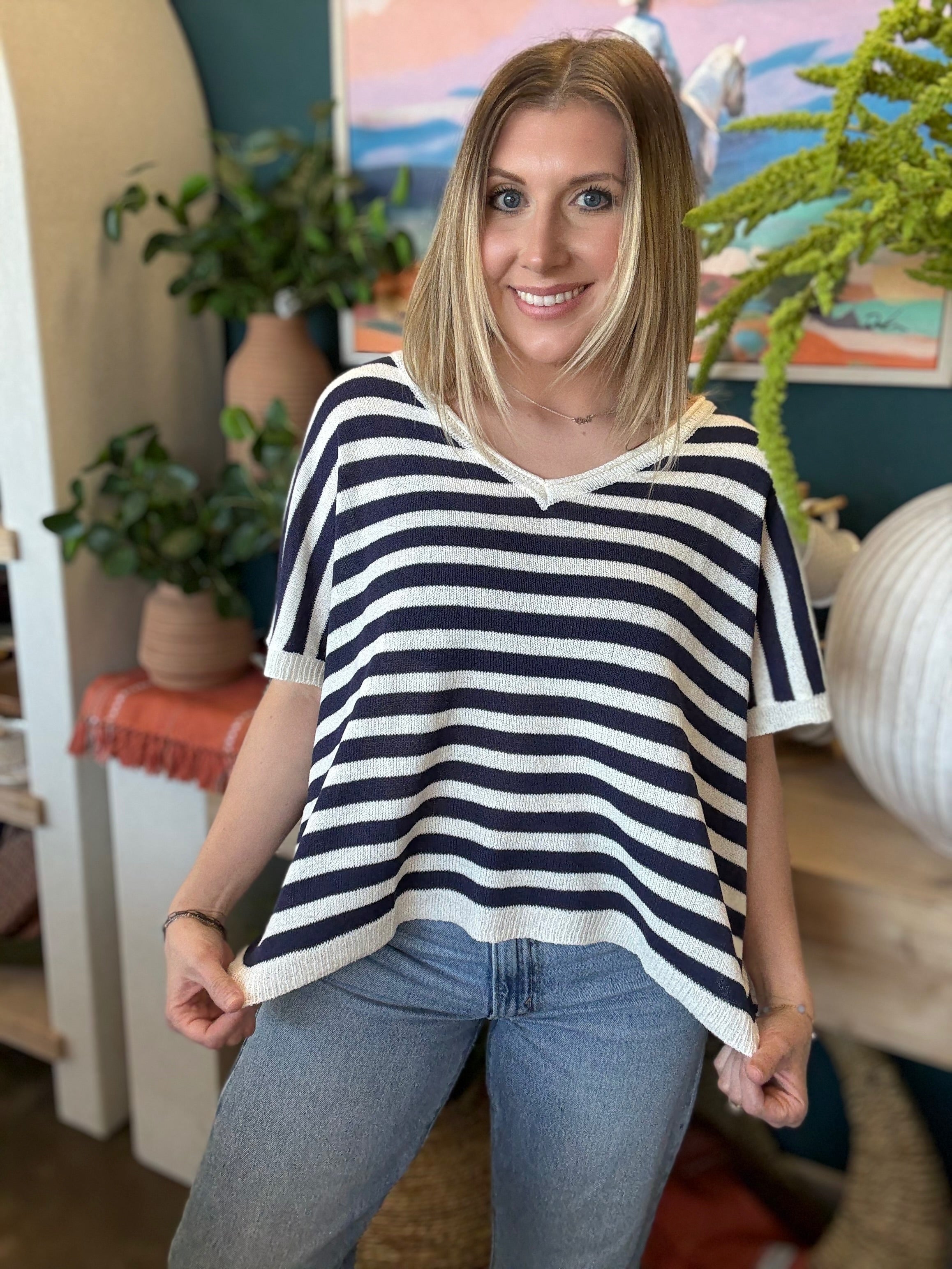 woman wearing navy striped boutique knit sweater top