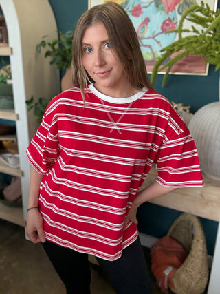 woman wearing red and white striped oversized patriotic boutique tee