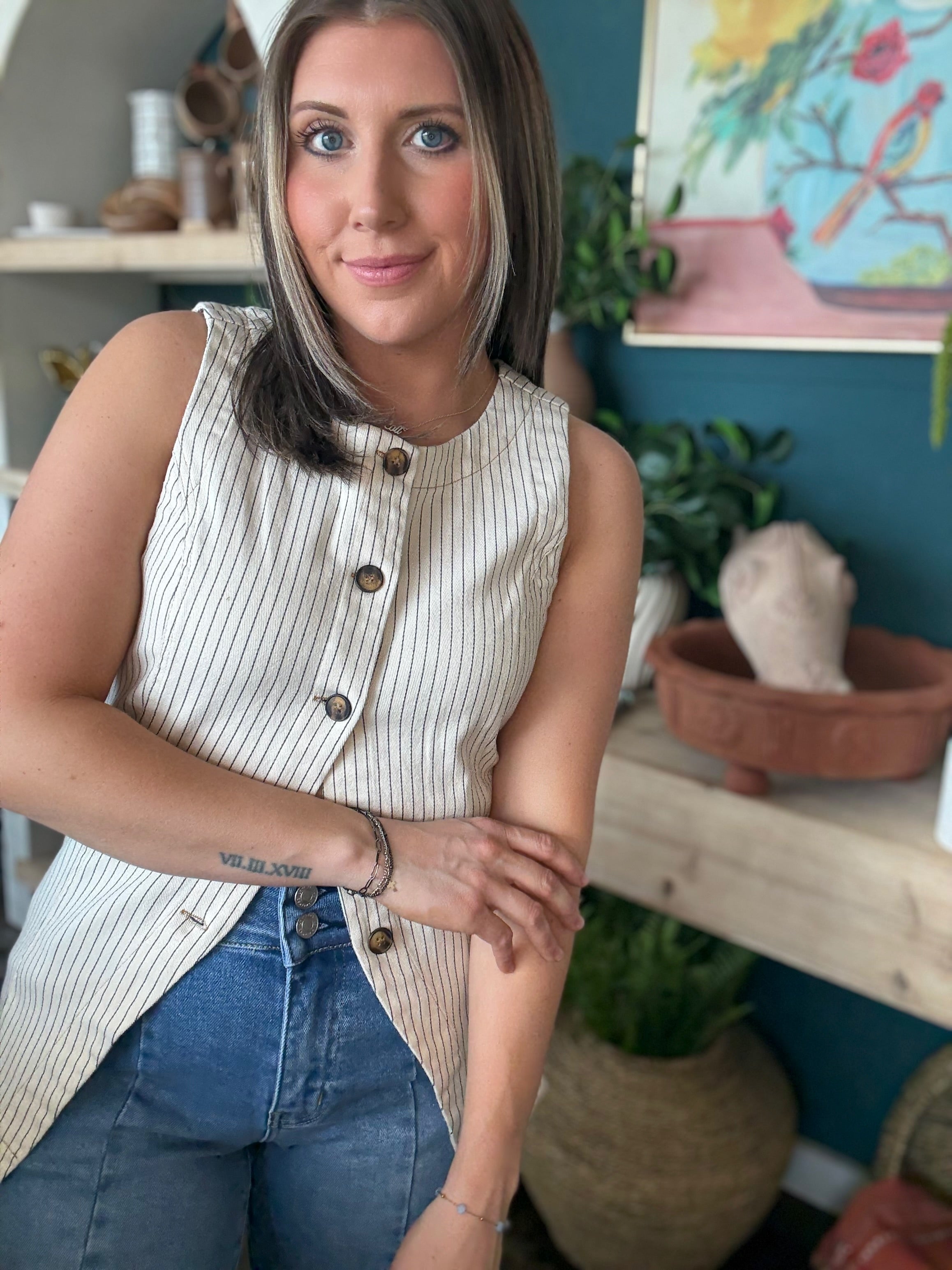 woman wearing natural striped sleeveless boutique button front tank top