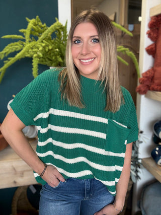 woman wearing emerald green striped boutique sweater top with pocket