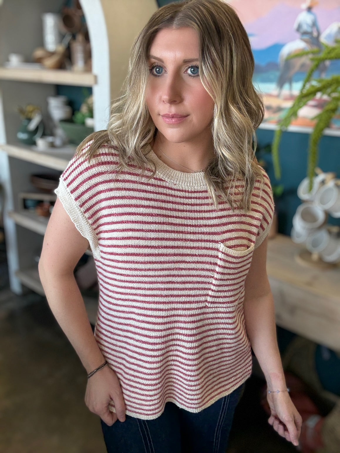 woman wearing red and cream striped boutique knit top with pocket