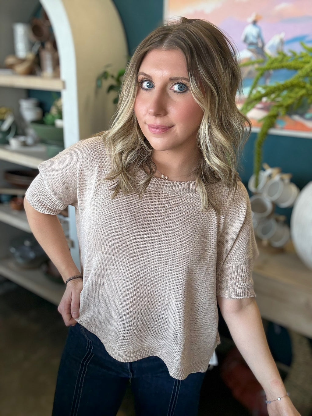 woman wearing neutral beige knit short sleeve boutique sweater top