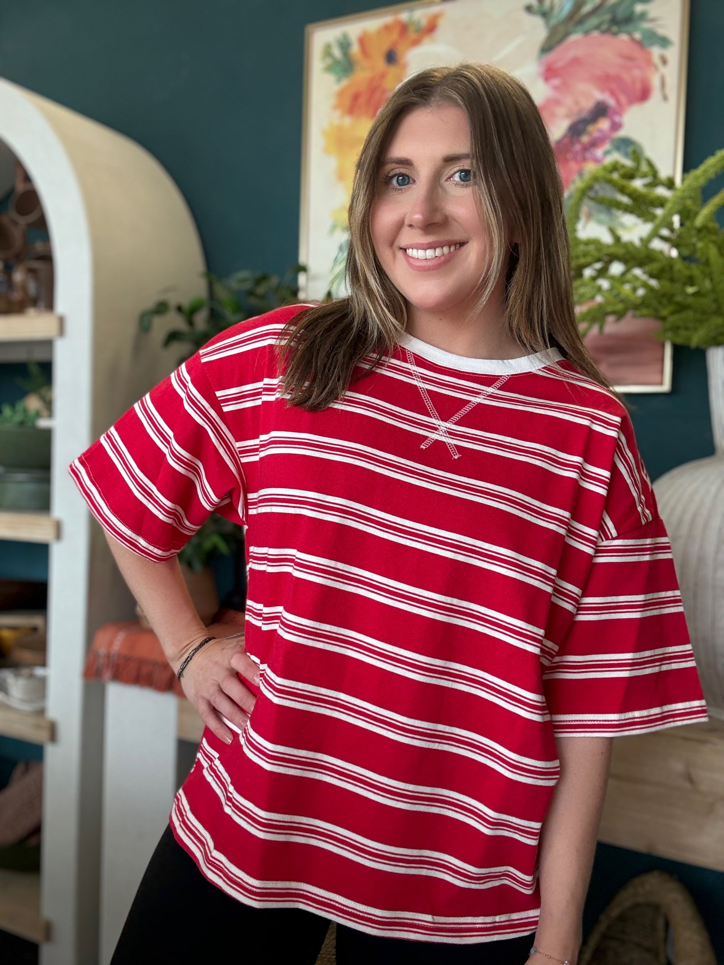 woman wearing red and white striped oversized patriotic boutique tee