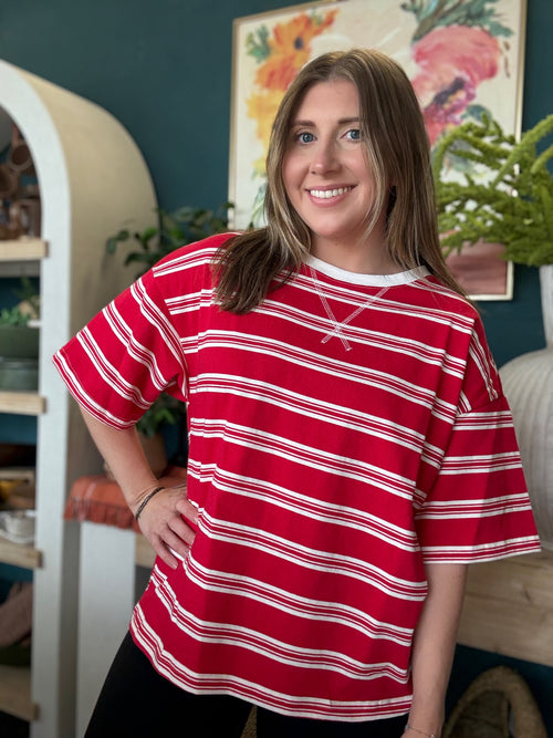 woman wearing red and white striped oversized patriotic boutique tee
