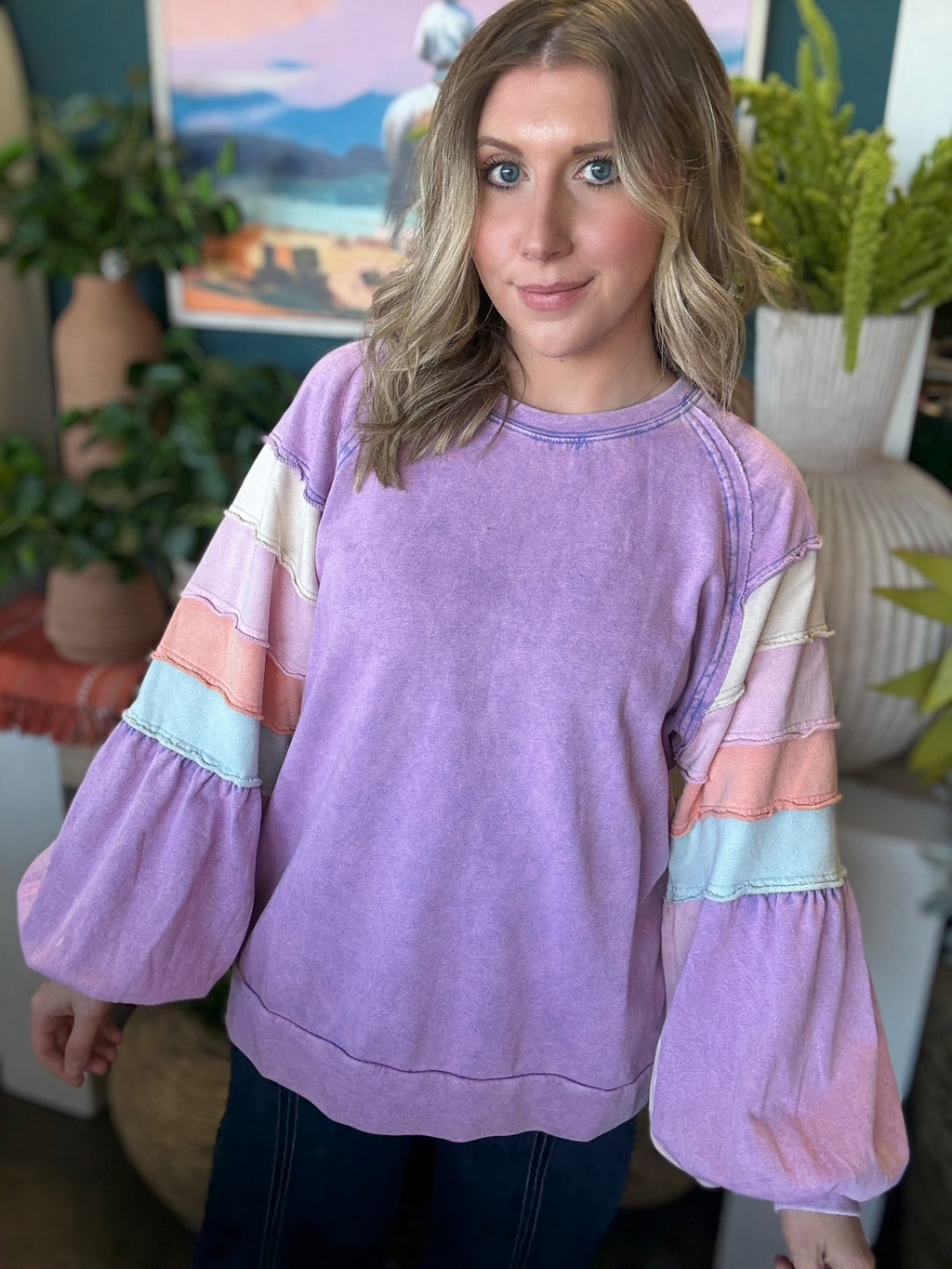 woman wearing lavender boutique pullover with pastel tiered sleeves