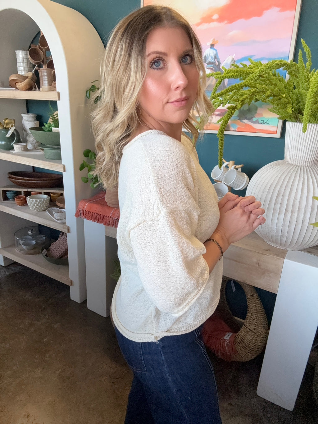 woman wearing cream textured puff sleeve boutique top