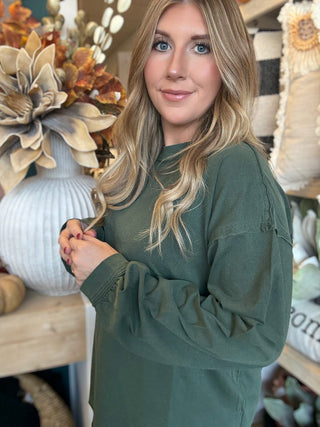 Woman wearing a regency-green washed long-sleeve tee with dropped shoulders and balloon sleeves
