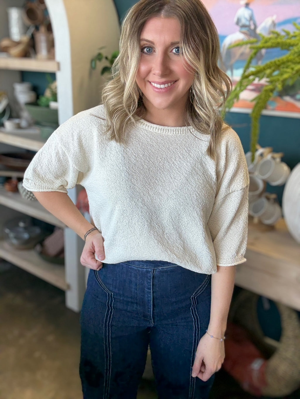 woman wearing cream textured puff sleeve boutique top