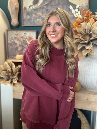 Burgundy mock neck sweatshirt with relaxed oversized fit