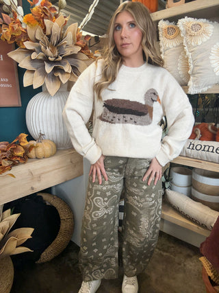 Ivory women’s sweater with oversized mallard duck graphic