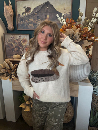 Ivory women’s sweater with oversized mallard duck graphic