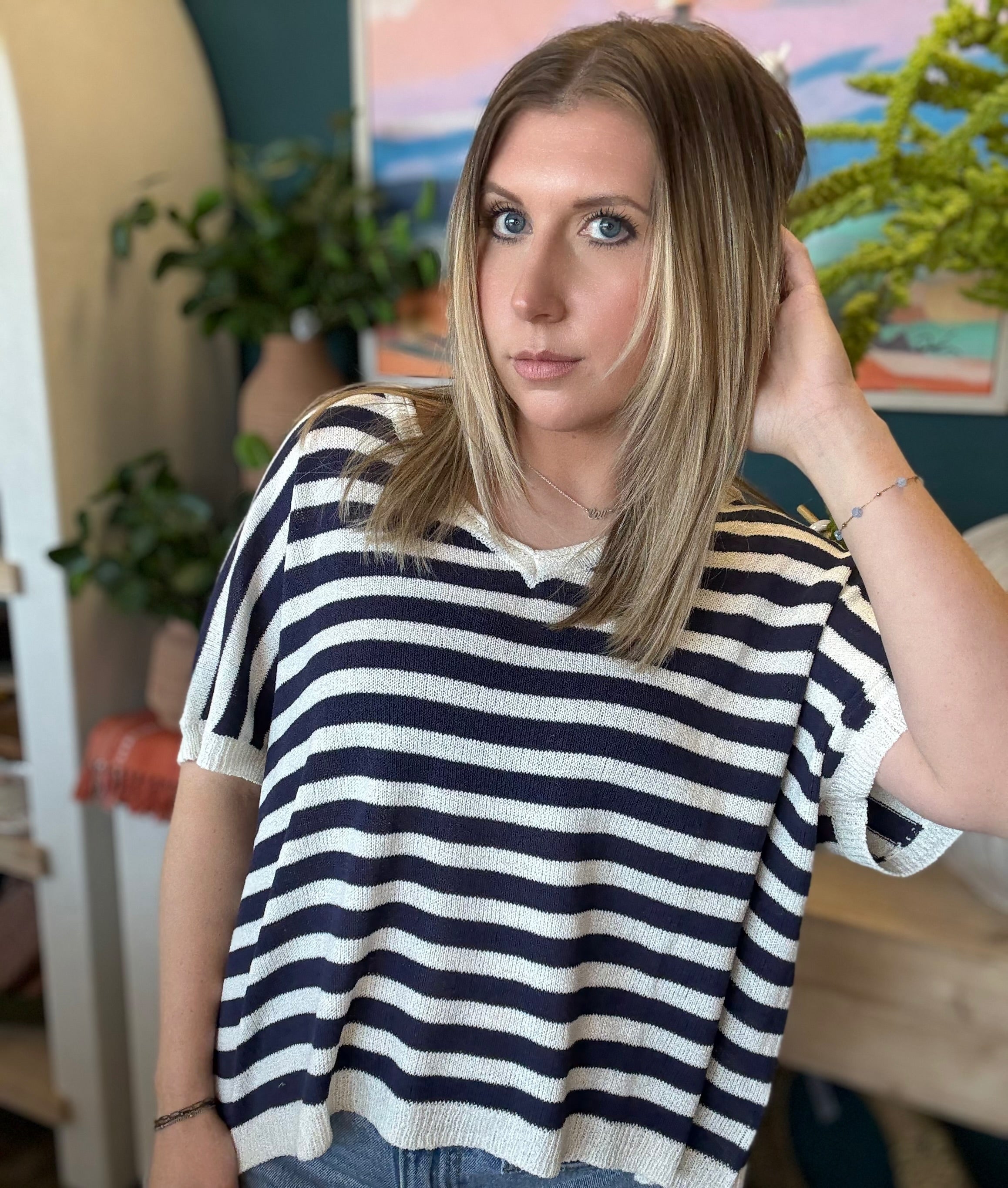 woman wearing navy striped boutique knit sweater top