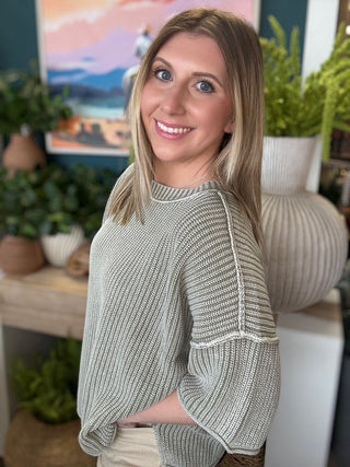 Sage ribbed knit short sleeve boutique top styled with neutral pants at Pill Box Boutique