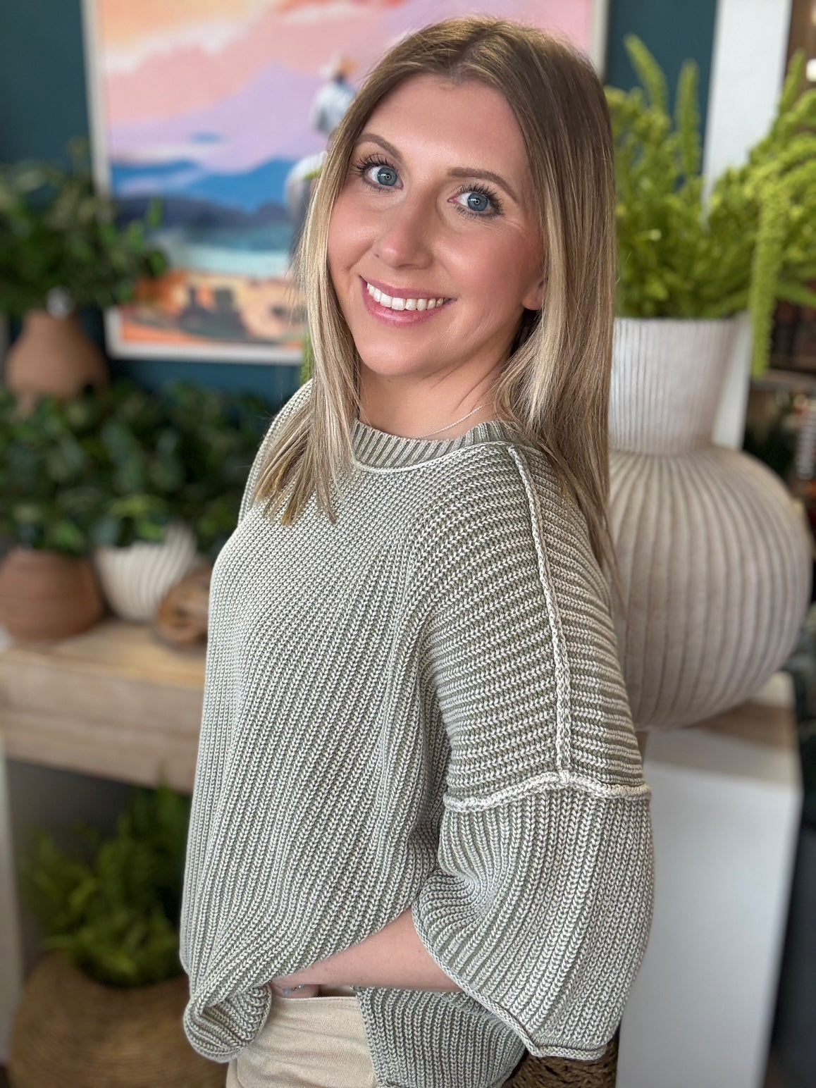 Sage ribbed knit short sleeve boutique top styled with neutral pants at Pill Box Boutique