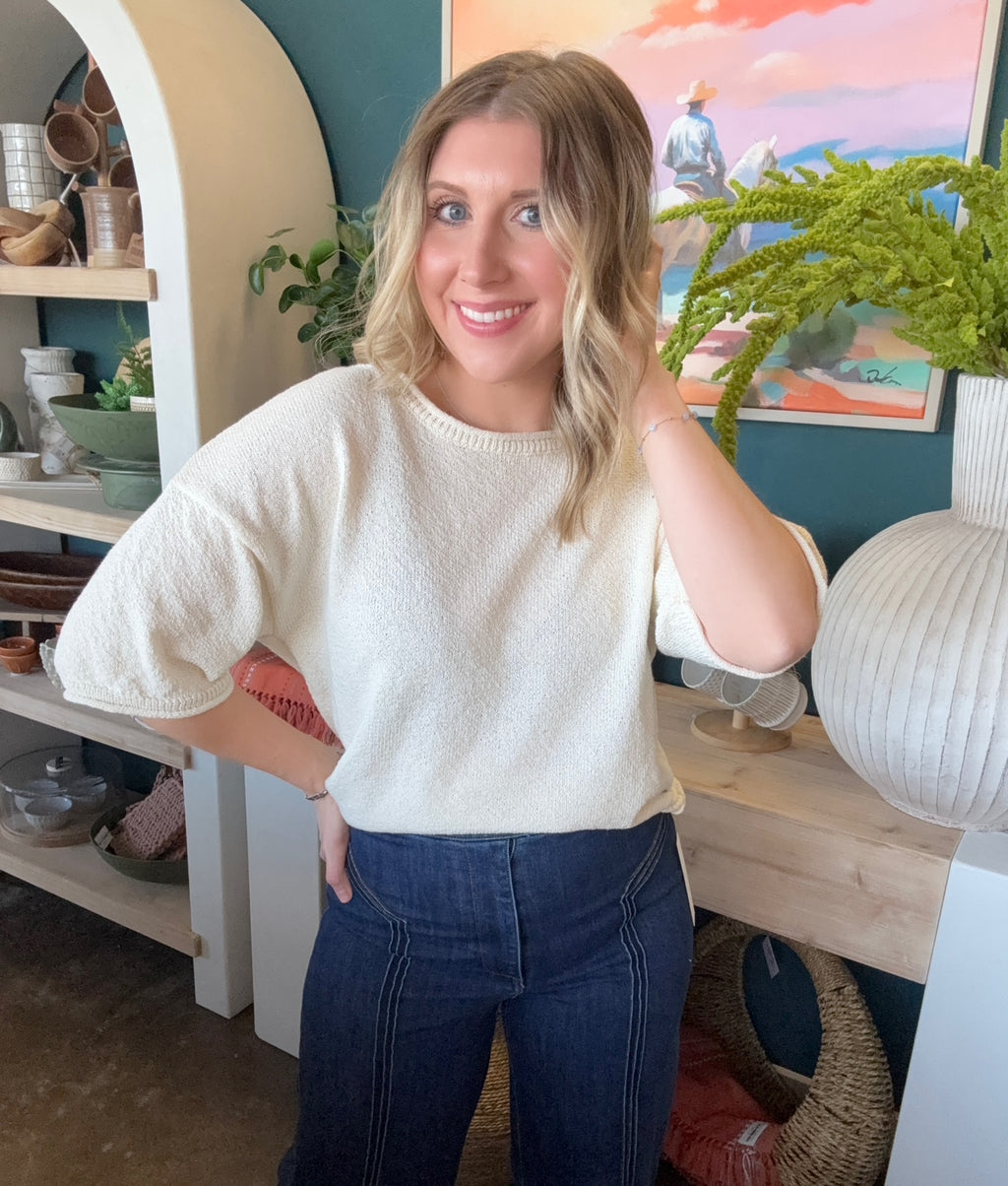 woman wearing cream textured puff sleeve boutique top