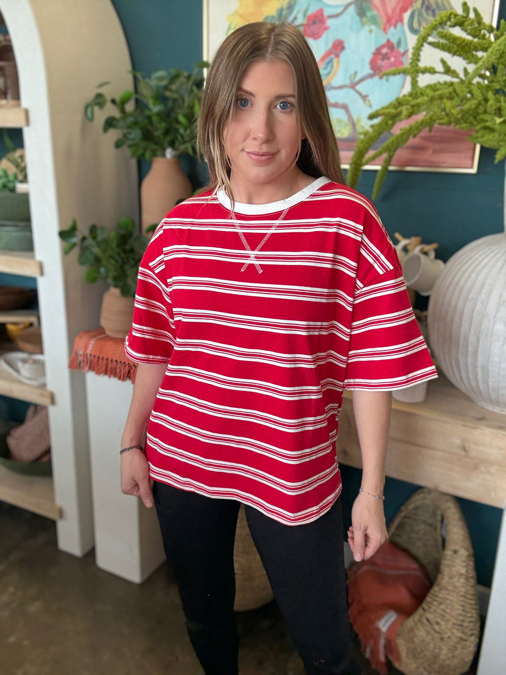 woman wearing red and white striped oversized patriotic boutique tee
