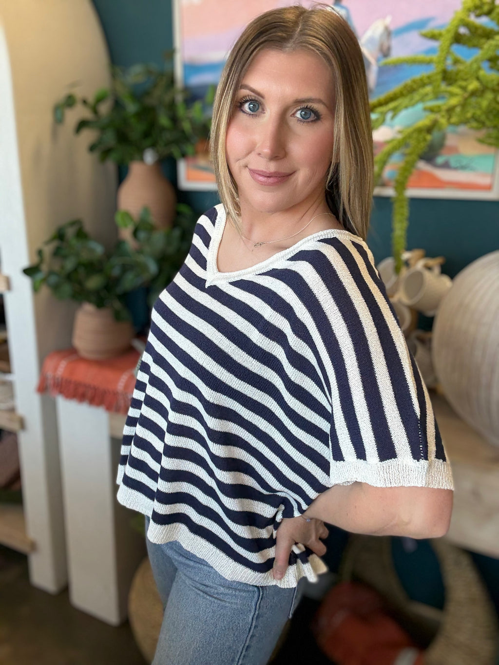 woman wearing navy striped boutique knit sweater top