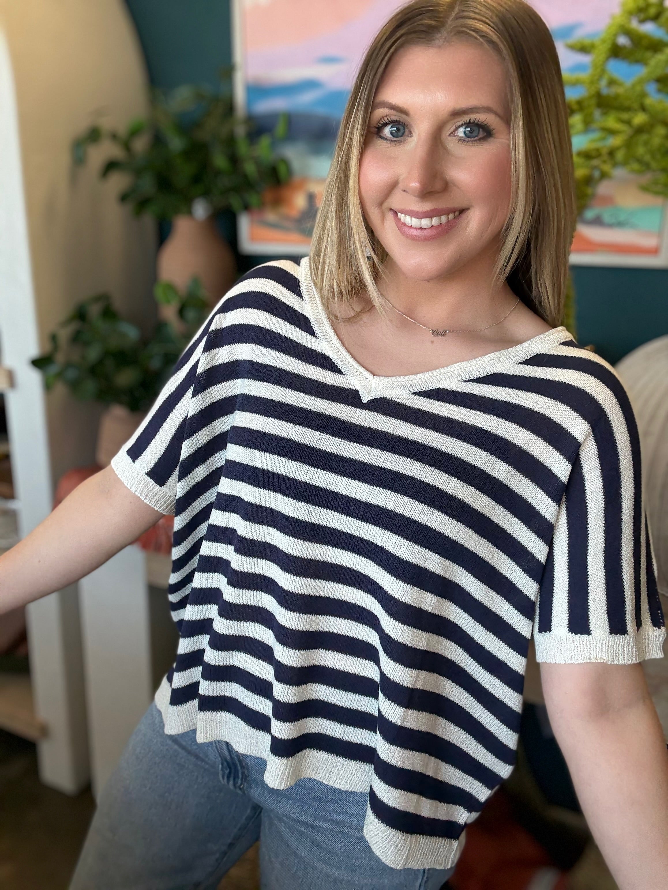 woman wearing navy striped boutique knit sweater top