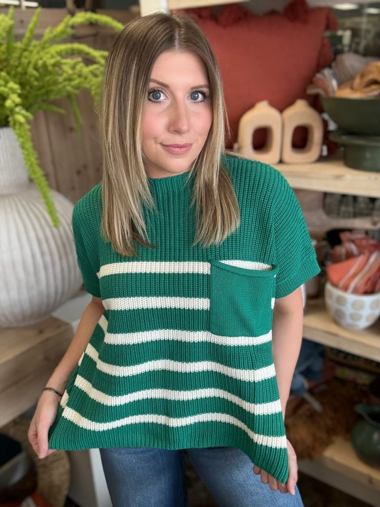 woman wearing emerald green striped boutique sweater top with pocket