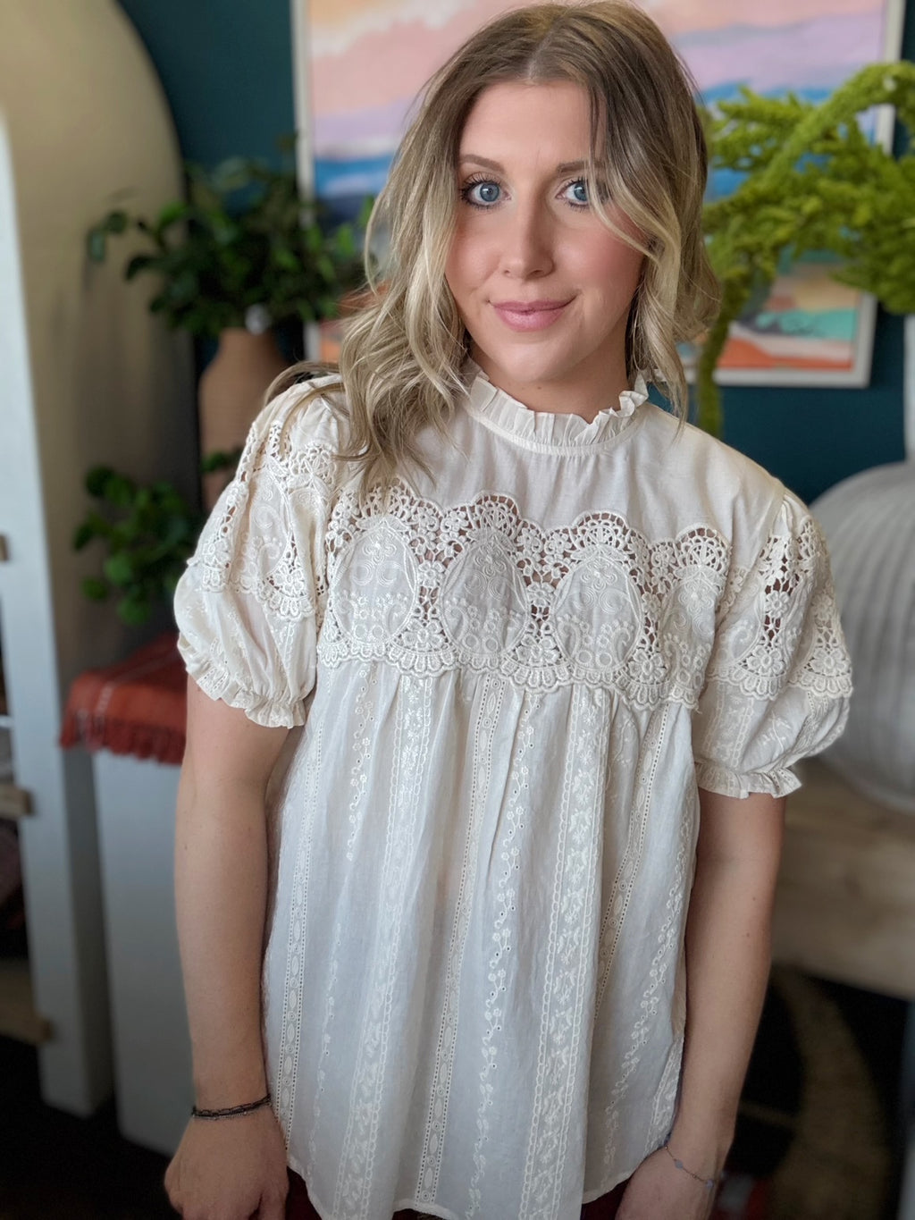 woman wearing vintage lace boutique blouse with mock neck and lace detailing