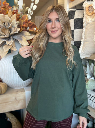 Woman wearing a regency-green washed long-sleeve tee with dropped shoulders and balloon sleeves