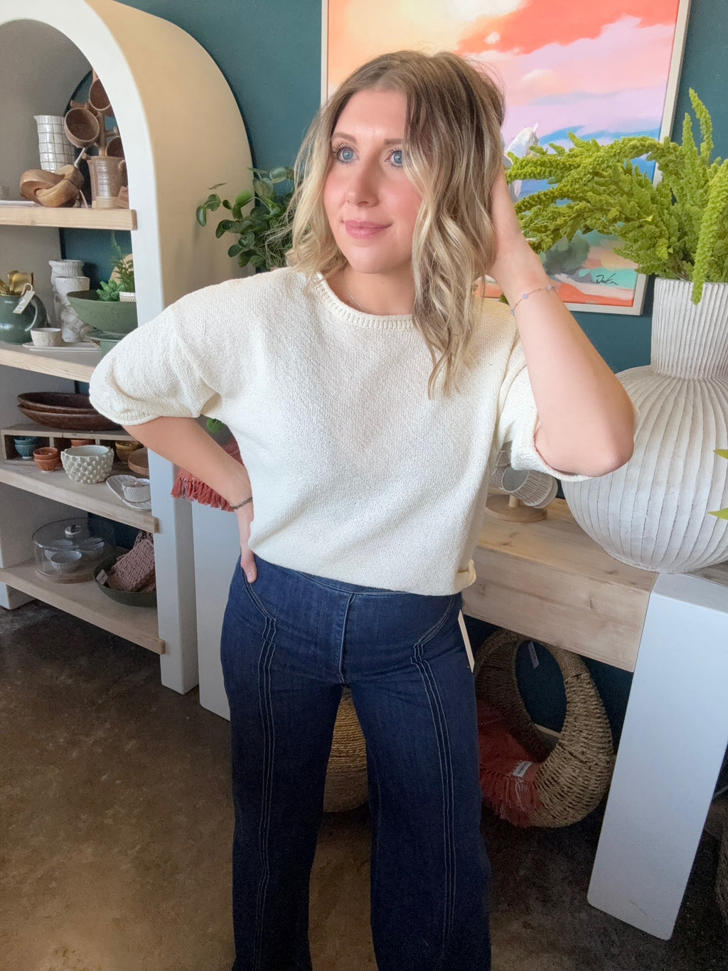 woman wearing cream textured puff sleeve boutique top