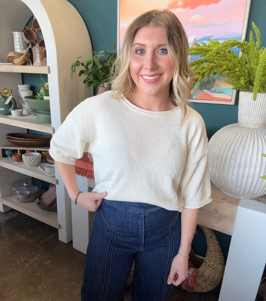 woman wearing cream textured puff sleeve boutique top