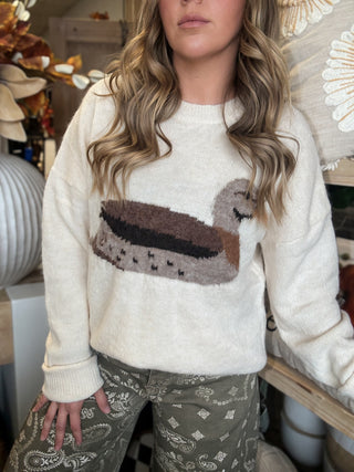 Ivory women’s sweater with oversized mallard duck graphic