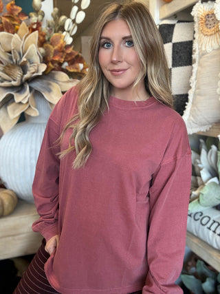 Woman wearing a winter-berry mineral-wash long-sleeve tee with dropped shoulders and balloon sleeves