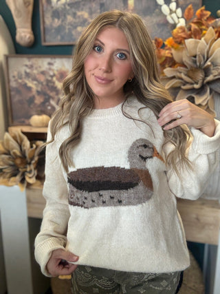 Ivory women’s sweater with oversized mallard duck graphic