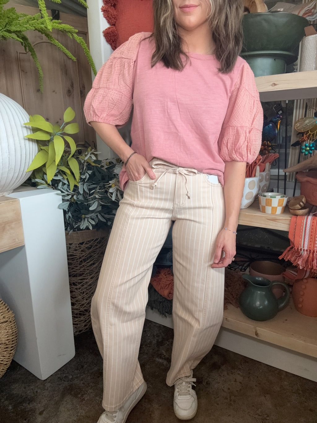 woman wearing sand striped drawstring boutique straight leg pants