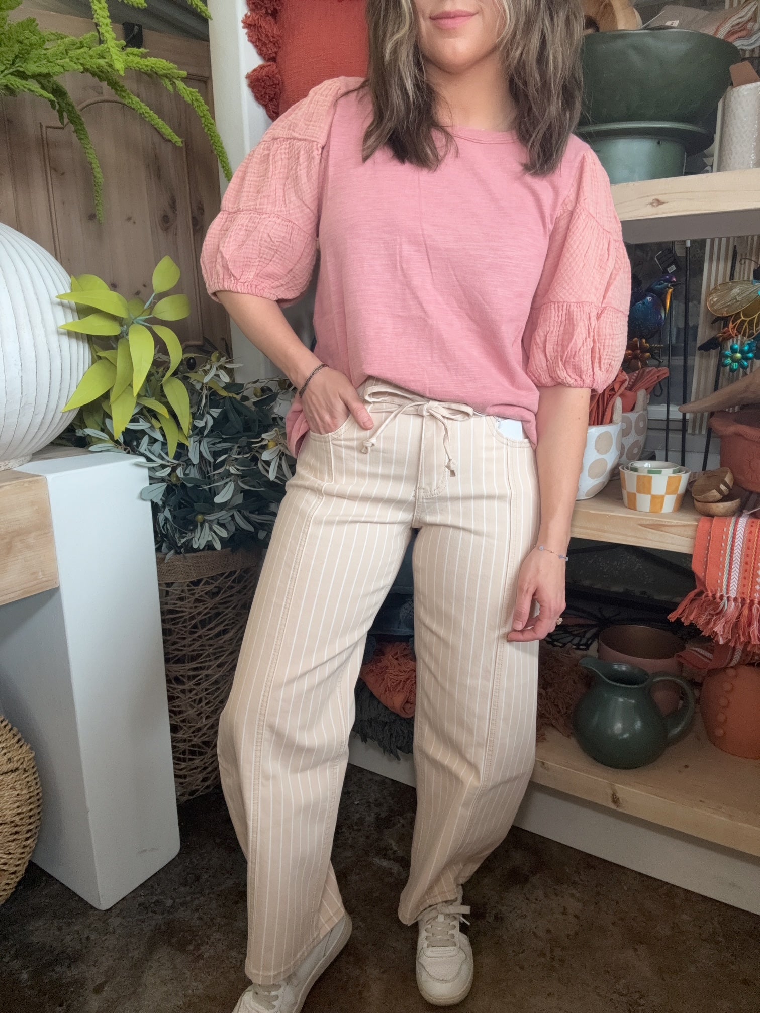 woman wearing sand striped drawstring boutique straight leg pants