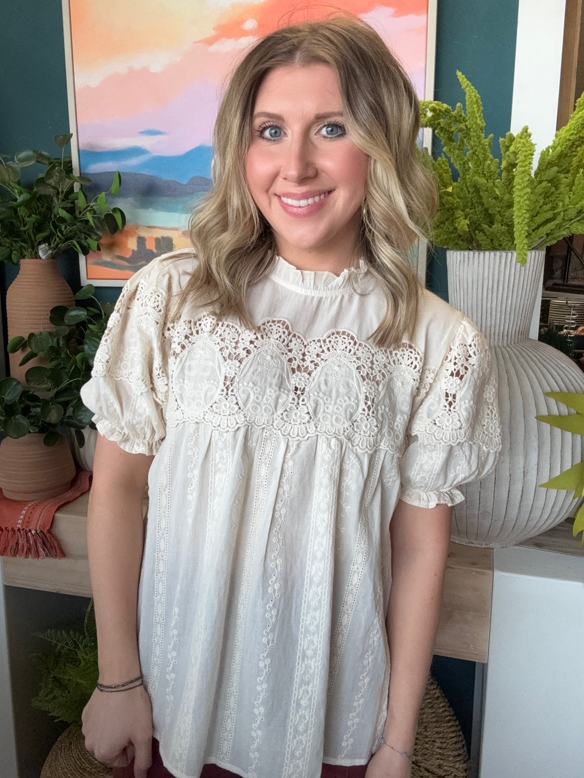 woman wearing vintage lace boutique blouse with mock neck and lace detailing