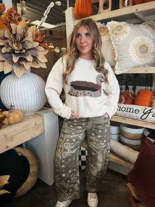 Ivory women’s sweater with oversized mallard duck graphic