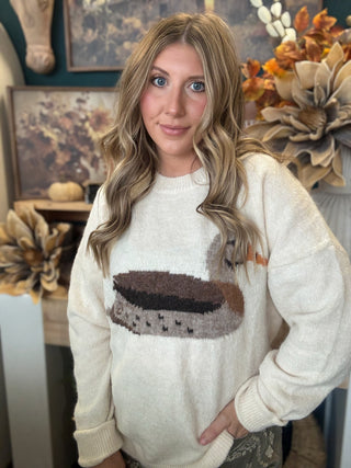 Ivory women’s sweater with oversized mallard duck graphic