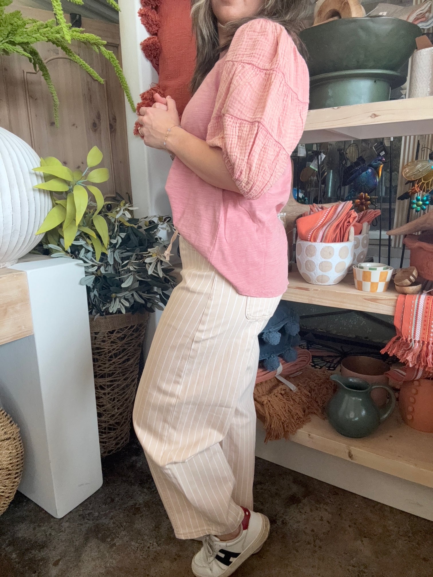 woman wearing sand striped drawstring boutique straight leg pants