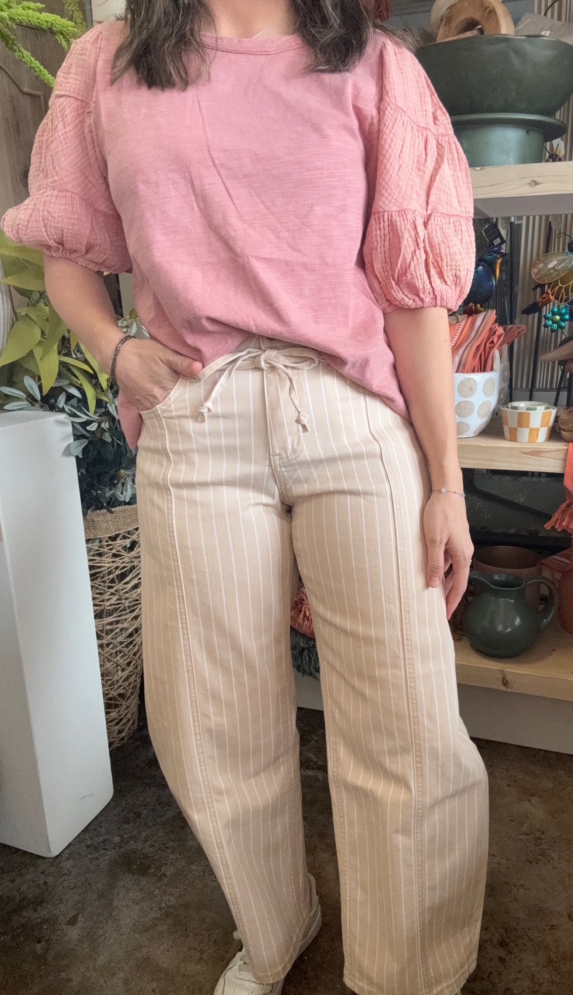woman wearing sand striped drawstring boutique straight leg pants